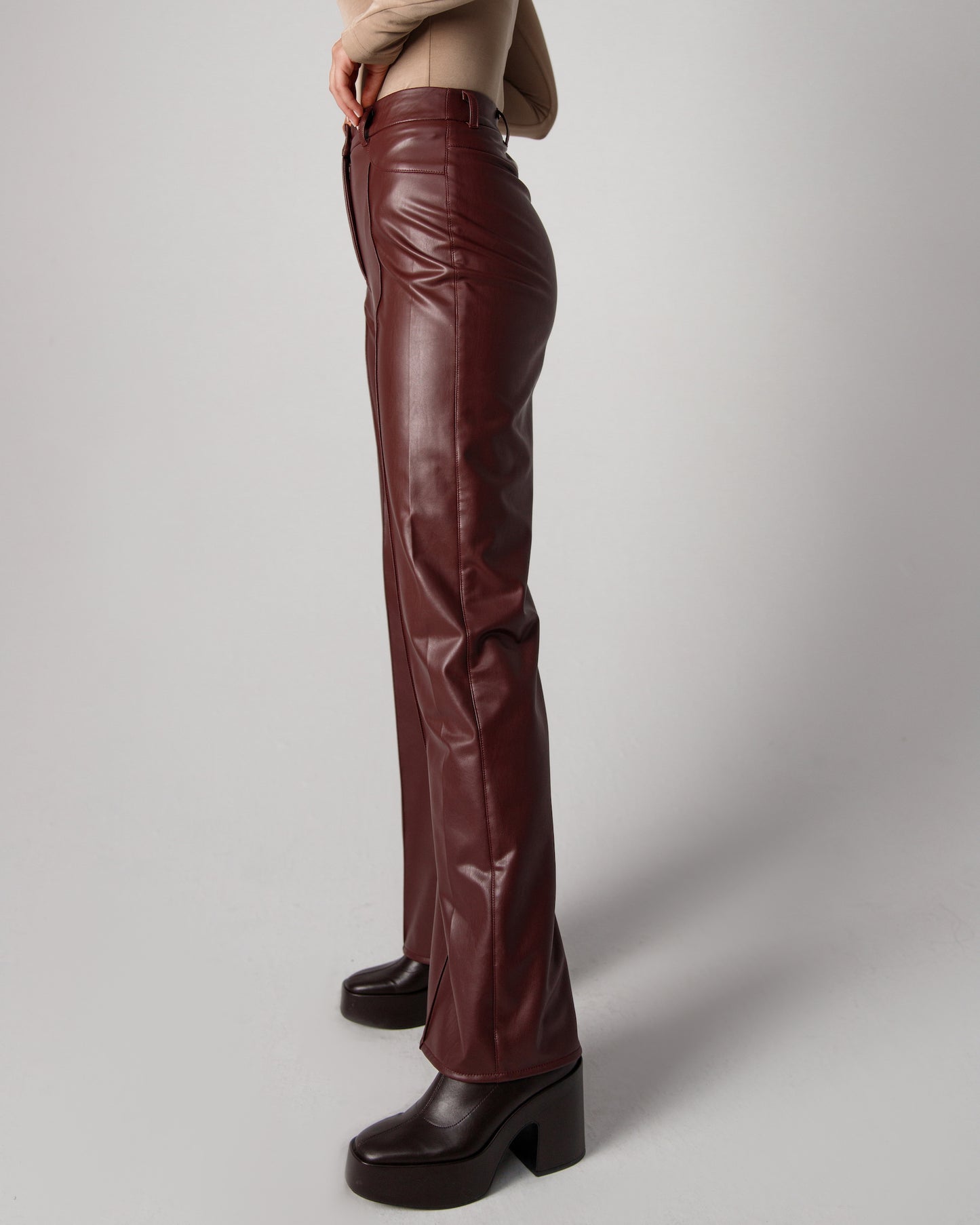 Soft vegan leather pants in maroon